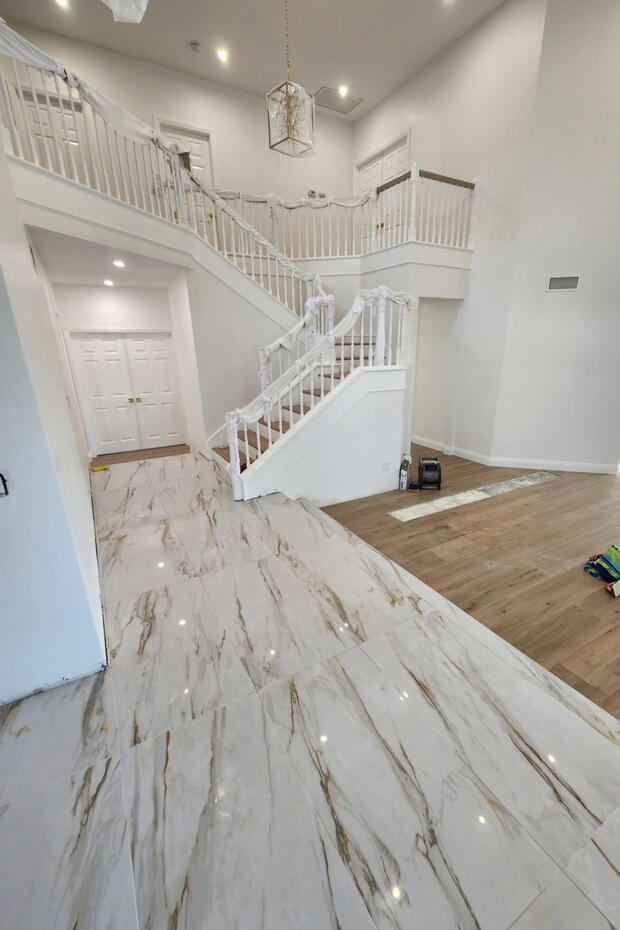 Complete home renovation project showing updated flooring, interior finishes, and remodeled living spaces.
