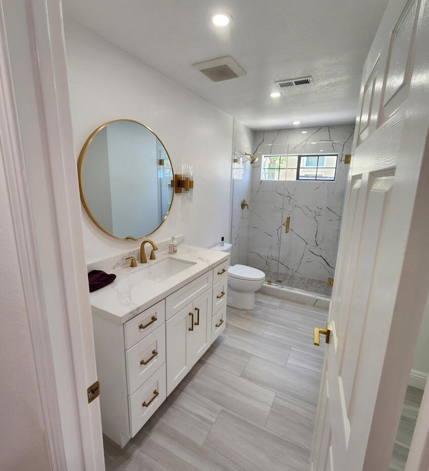 Bathroom remodeling project with updated tile, fixtures, shower area, and modern finishes.