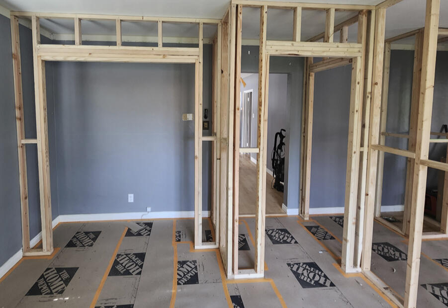 Residential framing project showing newly constructed interior wall framing during a home renovation.