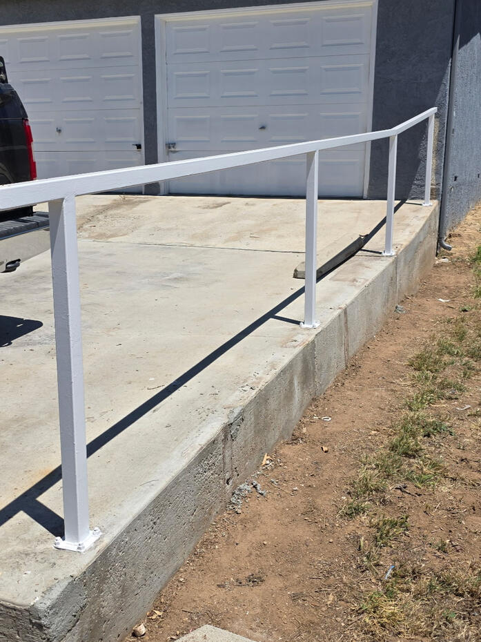 Outdoor home improvement project featuring exterior landscaping or hardscape upgrades.